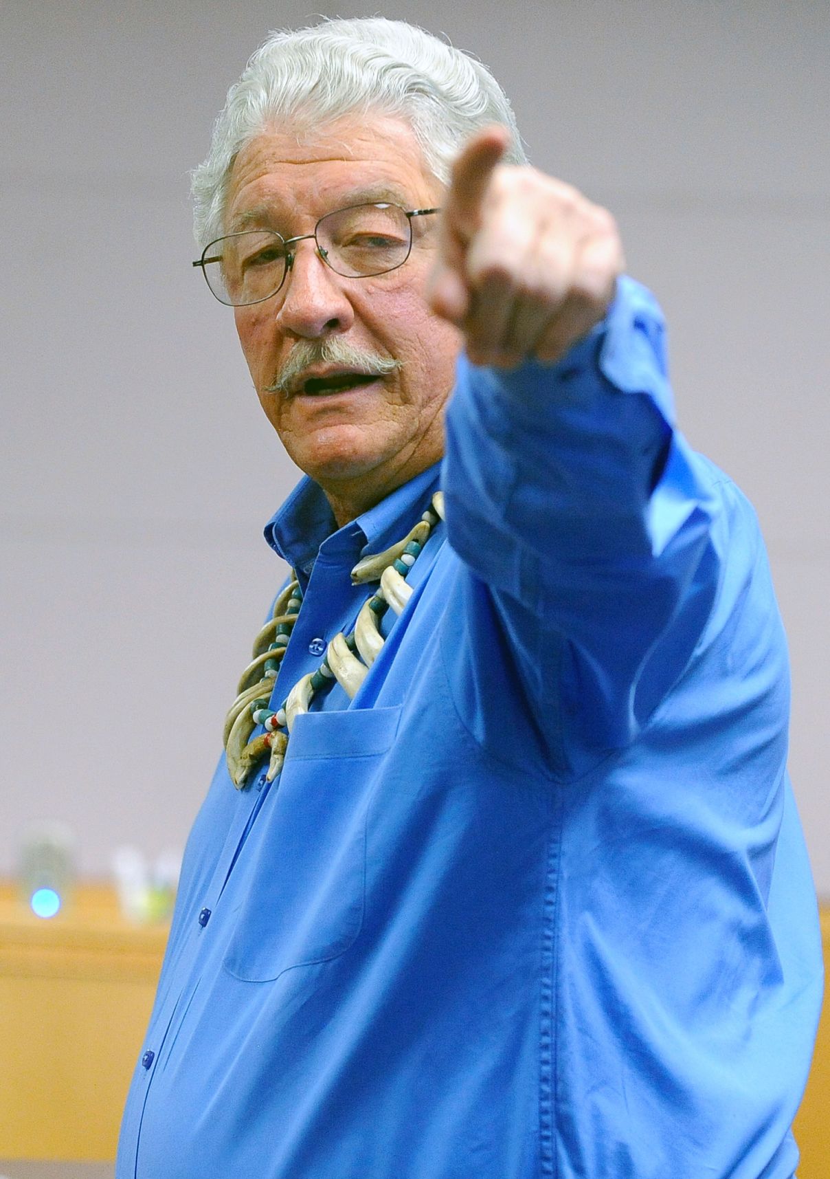 Jim Leachman points to a law officer